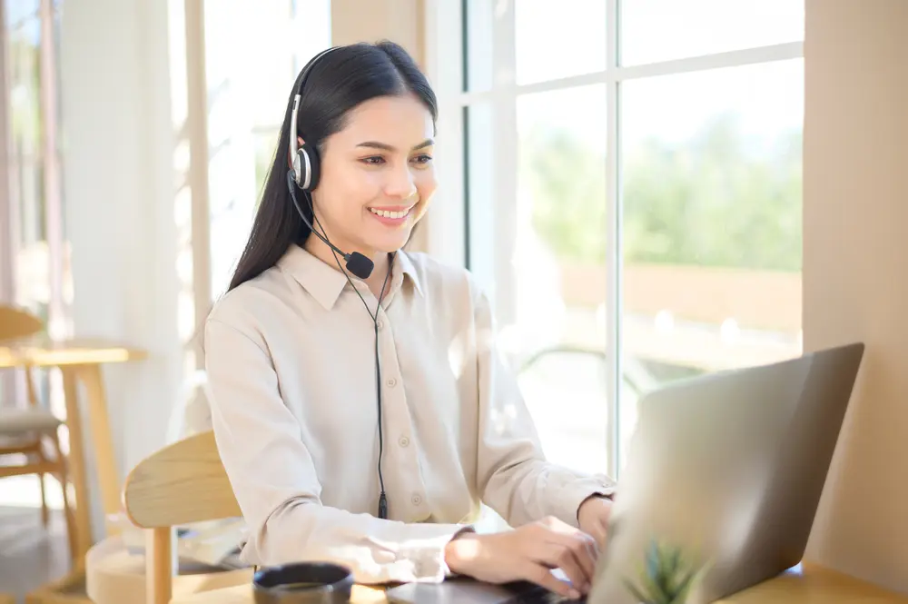 Lady working on laptop customer service