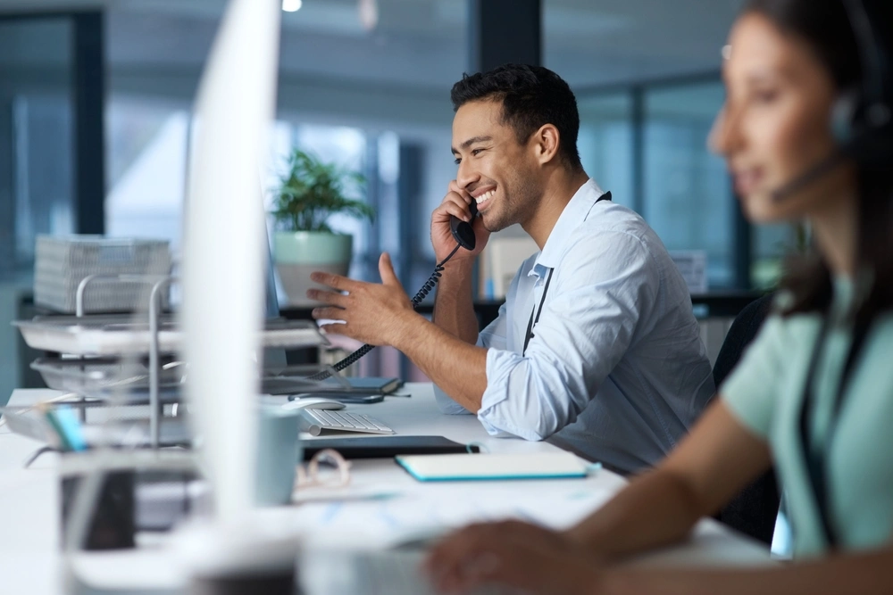 Man answering a call at Call Answering Service